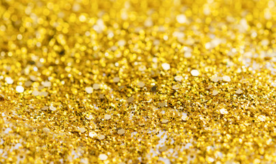 Abstract composition. Golden glitter light background with beautiful bokeh, selective focus, shallow depth of field