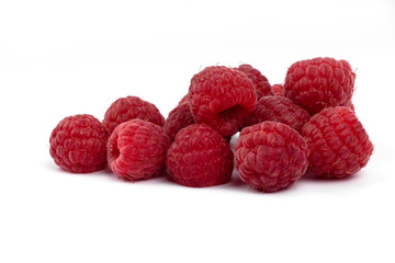 Group of fresh tasty berries raspberries laying on white background