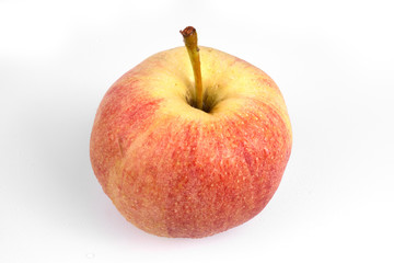 Close-up top view on one apple with long stem on white background