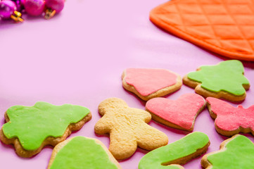Christmas ginger biscuits on pink