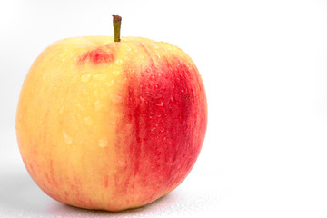 Front view on one organic tasty colorful apple on white background