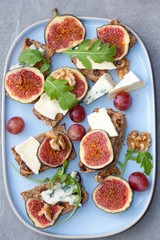 Tasty open sandwiches with fig fruits.