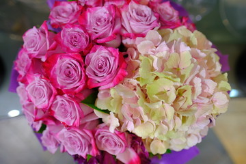 Macro view of colorful blue red green white pink orange purple rose flower bouquet in full blossom