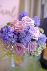 Macro view of colorful blue red green white pink orange purple rose flower bouquet in full blossom