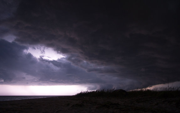 Gorgeous photo of the storm clouds passing by the beach of the sea of Azov