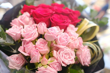 Macro view of colorful blue red green white pink orange purple rose flower bouquet in full blossom