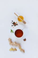 Ingredients for herbal ginger tea with honey, star anise and anise. Healthy food detox concept. Flat lay with space for text. Top view.