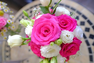 Macro view of colorful blue red green white pink orange purple rose flower bouquet in full blossom