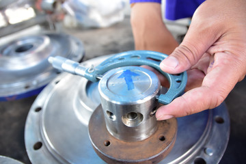 Technician use an Out-side Micrometer to measure the shaft's diameter. In the Water Circulation Pump repair work