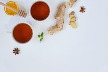 Ingredients for herbal ginger tea with honey, star anise and anise. Healthy food detox concept. Flat lay with space for text. Top view.
