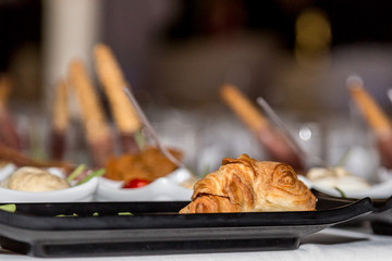 Tasty croissant sandwich with cheese and ham