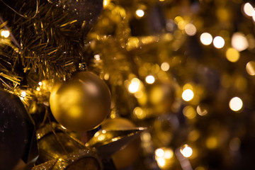 Close up of Christmas golden decoration with sparkles and lighjts