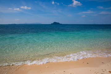 Fototapeta na wymiar View of the turquoise water beach with light sand