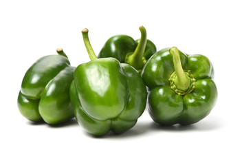 fresh green bell pepper (capsicum) on a white background