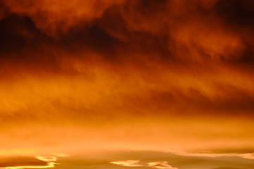 Fototapeta premium Clouds in the sky with burgundy color