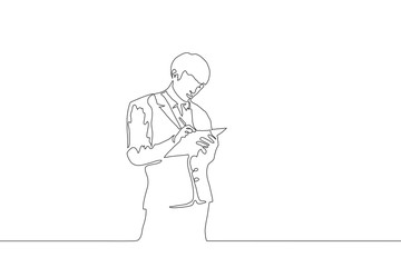 Continuous one line art a young man holds a folder with his left hand and writes with a pen on it with his right hand. Line sketch of businessman in a suit on a white background. Black stroke drawing