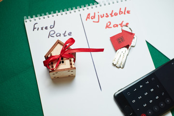Comparison and calculation of rates on the calculator. Getting a mortgage with a keychain in the shape of a house
