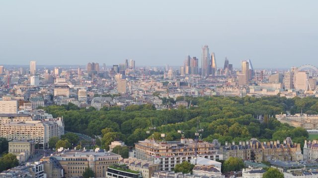 Panning aerial establishing shot of central london featuring Buckingham palace and surrounding parks