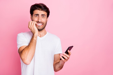 Portrait of unhappy negative worried scared middle eastern use hold cellphone read novelty get...