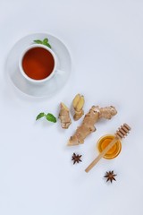 Ingredients for herbal ginger tea with honey, star anise and anise. Healthy food detox concept. Flat lay with space for text. Top view.