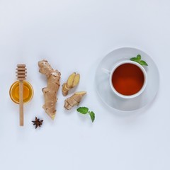 Ingredients for herbal ginger tea with honey, star anise and anise. Healthy food detox concept. Flat lay with space for text. Top view.