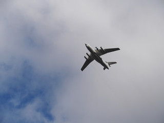 Plane in the sky in cloudy weather closeup. The flight of the aircraft.