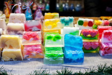 Pieces of handmade soap sold сhristmas market - obrazy, fototapety, plakaty