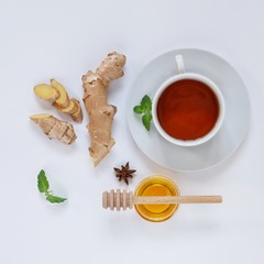 Ingredients for herbal ginger tea with honey, star anise and anise. Healthy food detox concept. Flat lay with space for text. Top view.