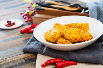 Chicken Wings Spicy chicken wings, breaded, fried, cooked.