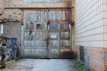 Old vintage wall with worn wooden door