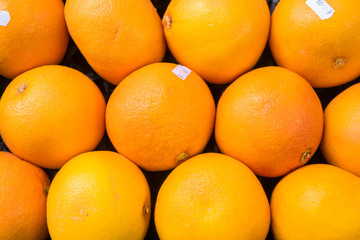 Organic oranges background on market