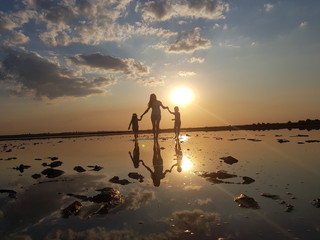silhouette of woman at sunset