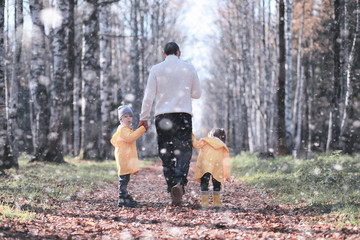 Kids walk in the park first snow