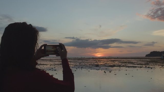 Back Shot Of A Millennial Girl Taking A Photo Of Sunset 4K