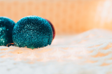 Christmas tree round decoration purple on a light knitted plaid and garland