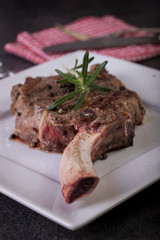 beautifully seared tomahawk steak, medium rare to rare