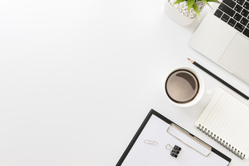 Flay lay, Top view office table desk with smartphone, keyboard, coffee, pencil, leaves with copy space background.