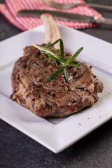 beautifully seared tomahawk steak, medium rare to rare