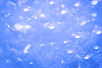 Beautiful abstract texture color white and blue bubbles background in water on blue background...