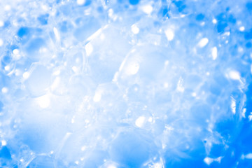 Beautiful abstract texture color white and blue bubbles background in water on blue background pattern clear soapy shiny