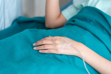 A doctor is taking care of a sick young woman with seasonal infections flu