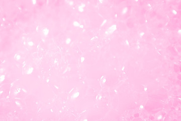 Beautiful abstract texture color white and pink bubbles background in water on pink background pattern clear soapy shiny
