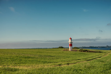 Fototapeta na wymiar Small lighthouse at Gendarmstien near Egernsund, Denmark