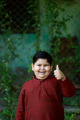 Image of a boy enjoying his holidays in the lap of nature