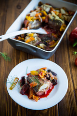 fish stew with beets and other vegetables in a plate