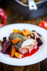 fish stew with beets and other vegetables in a plate