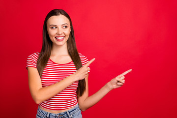 Photo of cute beautiful charming girl showing wearing jeans denim you sales and discounts while isolated with red background