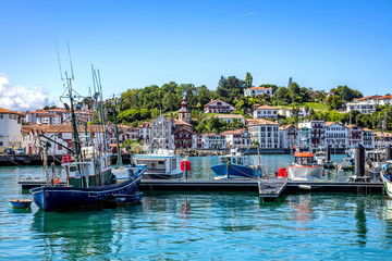 Fototapeta na wymiar Saint-Jean-de-Luz, France - View of the harbor and the village dwellings