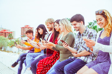 Teenager watching videos and social on smartphones - Addiction to new technology trends - Concept of youth, tech, social and friendship – Image