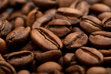 Fototapeta premium Coffee beans close-up background. Fresh roasted